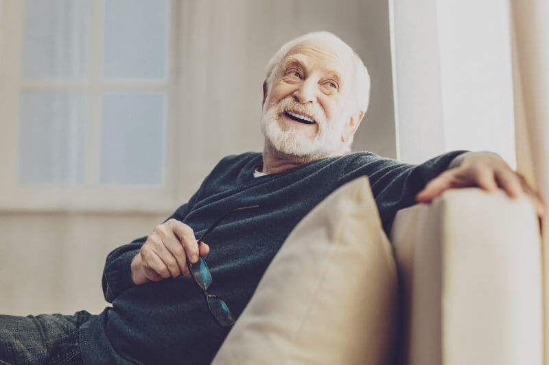 Grandpa looking at the window while smiling